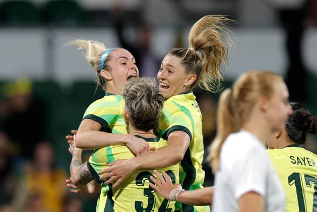 SOCCER AUSTRALIA SLOVENIA, Michelle Heyman of Australia is congratulated by Ellie Carpenter and Remy Siemsen of Australia after scoring a goal during the Women s friendly international soccer match between Australia and Slovenia at HBF Park in Perth, Sunday, June 29, 2025. ( NO ARCHIVING, EDITORIAL USE ONLY PERTH WESTERN AUSTRALIA AUSTRALIA  Copyright: xRICHARDxWAINWRIGHTx 20250629193129051134