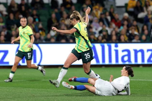 SOCCER AUSTRALIA SLOVENIA, Remy Siemsen of Australia is tackled by Sara Agrez of Slovenia during the Women s friendly international soccer match between Australia and Slovenia at HBF Park in Perth, Sunday, June 29, 2025. ( NO ARCHIVING, EDITORIAL USE ONLY PERTH WESTERN AUSTRALIA AUSTRALIA  Copyright: xRICHARDxWAINWRIGHTx 20250629146671080921