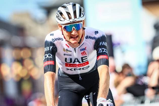 Belgian Tim Wellens of UAE Team Emirates celebrates as he crosses the finish line to win the men s elite road race of the Belgian Cycling Championships, 230km from and to the Grand Place square in Binche on Sunday 29 June 2025. DAVIDxPINTENS  x128062984x