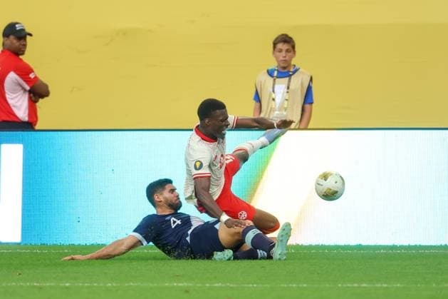 June 29th, 2025: Guatemala defender Jose Pinto (4) defends against Canada forward Tani Oluwaseyi (12) during a CONCACAF Gold Cup quarterfinals soccer match between Canada and Guatemala at US Bank Stadium in Minneapolis, MN. -CSM. Minneapolis USA - ZUMAc04_ 20250629_zma_c04_176 Copyright: xStevenxGarciax