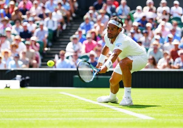 Fabio Fognini switches his racket to his other hand to return serve during his first round match Wimbledon Tennis Championships, Day 1, The All England Lawn Tennis and Croquet Club, London, UK - 30 Jun 2025London The All England Lawn Tennis and United Kingdom  Copyright: xJavierxGarcia Shutterstockx 15378843cw