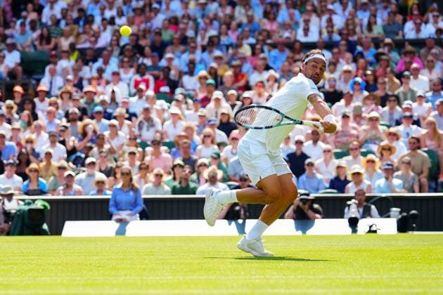 Fabio Fognini plays a shot behind his back during his first round match Wimbledon Tennis Championships, Day 1, The All England Lawn Tennis and Croquet Club, London, UK - 30 Jun 2025London The All England Lawn Tennis and United Kingdom  Copyright: xJavierxGarcia Shutterstockx 15378843em