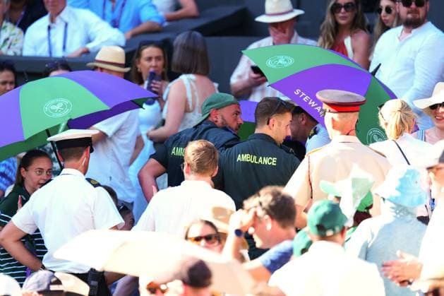 Ambulance crew attend to a medical emergency in the crowd on Centre Court Wimbledon Tennis Championships, Day 1, The All England Lawn Tennis and Croquet Club, London, UK - 30 Jun 2025London The All England Lawn Tennis and United Kingdom  Copyright: xJavierxGarcia Shutterstockx 15378843iu