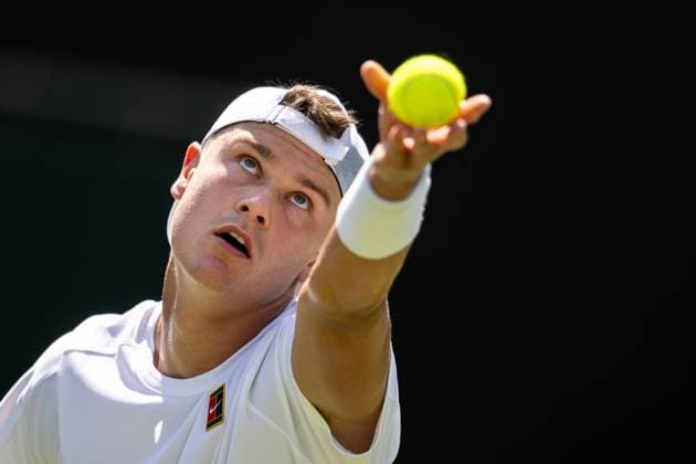250630 Holger Rune of Denmark competes in a first round singles tennis match during day 1 of Wimbledon on June 30, 2025 in London. Photo: Petter Arvidson BILDBYRAN kod PA PA1043 tennis wimbledon day 1 bbeng danmark Copyright: PETTERxARVIDSON BB250630PA033