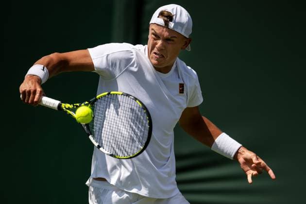 250630 Holger Rune of Denmark competes in a first round singles tennis match during day 1 of Wimbledon on June 30, 2025 in London. Photo: Petter Arvidson BILDBYRAN kod PA PA1043 tennis wimbledon day 1 bbeng danmark Copyright: PETTERxARVIDSON BB250630PA034