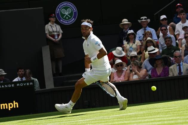 (250701) -- LONDON, July 1, 2025 -- Fabio Fognini hits a return during the men s singles first round match between Carlos Alcaraz of Spain and Fabio Fognini of Italy at Wimbledon Tennis Championship in London, Britain, June 30, 2025. ) ) (SP)BRITAIN-LONDON-TENNIS-WIMBLEDON-MEN S SINGLES ZhaoxDingzhe 