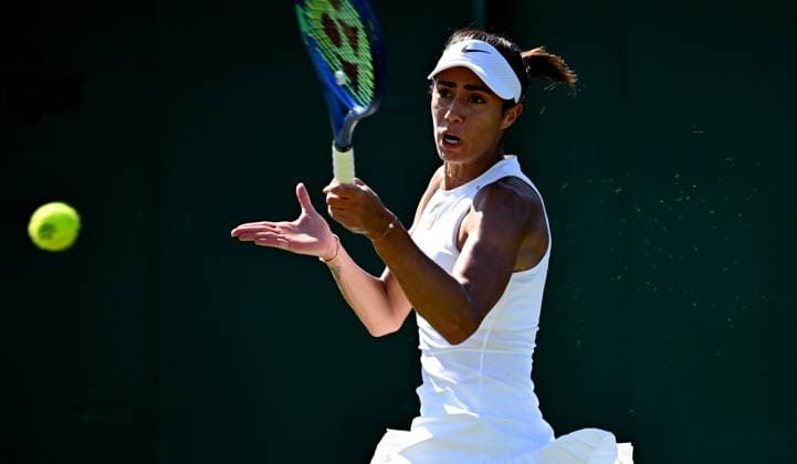 (250701) -- LONDON, July 1, 2025 -- Olga Danilovi hits a return during the women s singles first round match between Zhang Shuai of China and Olga Danilovic of Serbia at Wimbledon tennis Championship in London, Britain, June 30, 2025. ) (SP)BRITAIN-LONDON-TENNIS-WIMBLEDON-WOMEN S SINGLES LixYing 