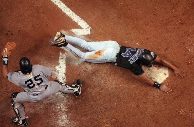 .Devil Rays vs. Yankees 6- Dave Martinez slides in with the Devil Rays first-ever inside-the-park home run in the bottom of the fourth inning. The homer gave the Devil Rays a 2-0 lead over the New York Yankees- -.Times Photo by:.Jonathan Newton.- -.Story By:.topkin et al..- -.SCANNED BY:.jrw.- - RUN DATE: .7 11 98 Copyright: xStxPetersburgxTimesx