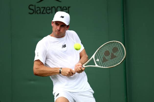 1st July 2025; All England Lawn Tennis and Croquet Club, London, England; Wimbledon Tennis Tournament, Day 2; Tommy Paul (USA) with a backhand shot to Johannus Monday (GBR)  ActionPlus12807387 JohnxPatrickxFletcher