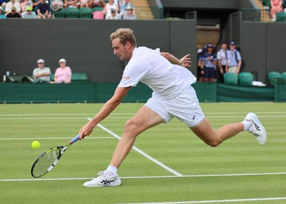 1st July 2025; All England Lawn Tennis and Croquet Club, London, England; Wimbledon Tennis Tournament, Day 2; Johannus Monday (GBR) with a forehand shot to Tommy Paul (USA)  ActionPlus12807421 JohnxPatrickxFletcher