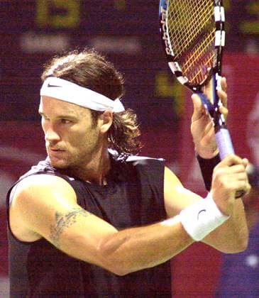 Jan 08, 2005; Madras, INDIA; Spain s Carlos Moya hits a ball against his countrymate Guillermo Garcia-Lopez, in a semifinal match of the ATP, Tennis Herren Chennai Open in Madras on January 8, 2005. Moya won the match. Madras INDIA Copyright: xTCxMalhotrax