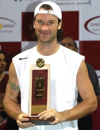 Jan 09, 2005; Madras, INDIA; CARLOS MOYA of Spain holds his trophy after winning the ATP, Tennis Herren Tour Chennai Open tennis championship at the south Indian city of Madras on January 09, 2005. The world number five tennis player beated Thai star Paradorn Srichaphan 3-6, 6-4, 7-6 (7-5) in the final match. Moya donated his entire 8,770 prize money to relief efforts for the December 26 tsunami-earthquake catastrophe that killed more than 150,000 in Asia. Madras INDIA Copyright: xTCxMalhotrax