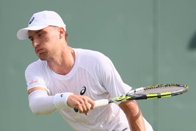 Belgian Raphael Collignon pictured in action at a tennis game against Croatian Cilic, in the first round of the men s singles at the 2025 Wimbledon grand slam tournament, Tuesday 01 July 2025 at the All England Tennis Club, in South-West London, Britain. BENOITxDOPPAGNE  x128220983x