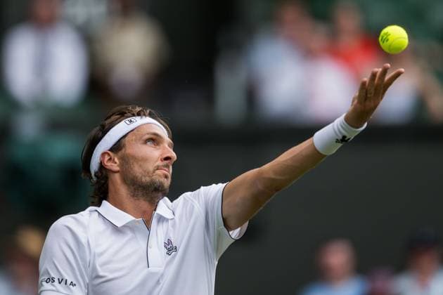 250701 Arthur Rinderknech of France competes in a first round singles tennis match during day 2 of Wimbledon on July 1, 2025 in London. Photo: Petter Arvidson BILDBYRAN kod PA PA1045 tennis wimbledon day 2 bbeng Copyright: PETTERxARVIDSON BB250701PA046