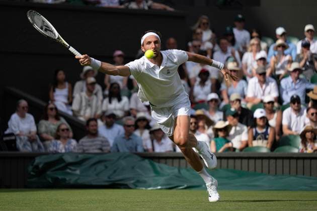 Day Two: The Championships - Wimbledon 2025 LONDON, ENGLAND - JULY 1: Arthur Rinderknech of France in action against Alexander Zverev of Germany (not pictured) during the Gentlemen s Singles first round match on day two of The Championships Wimbledon 2025 at All England Lawn Tennis and Croquet Club on July 1, 2025 in London, England. Arthur Rinderknech London All England Lawn Tennis and Croq England United Kingdom Copyright: xVisionhausx 776301250