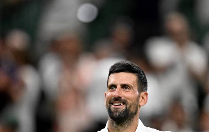(250702) -- LONDON, July 2, 2025 -- Novak Djokovic reacts after winning the men s singles first round match between Novak Djokovic of Serbia and Alexandre Muller of France at the Wimbledon Tennis Championships in London, Britain, July 1, 2025. ) (SP)BRITAIN-LONDON-TENNIS-WIMBLEDON-MEN S SINGLES LixYing 
