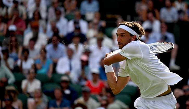 (250702) -- LONDON, July 2, 2025 -- Arthur Rinderknech hits a return during the men s singles first round match between Alexander Zverev of Germany and Arthur Rinderknech of France at the Wimbledon Tennis Championships in London, Britain, July 1, 2025. ) (SP)BRITAIN-LONDON-TENNIS-WIMBLEDON-MEN S SINGLES LixYing 