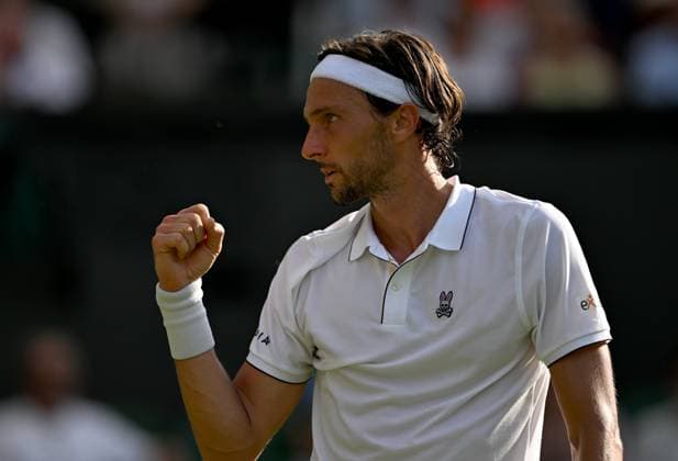 (250702) -- LONDON, July 2, 2025 -- Arthur Rinderknech celebrates scoring during the men s singles first round match between Alexander Zverev of Germany and Arthur Rinderknech of France at the Wimbledon Tennis Championships in London, Britain, July 1, 2025. ) (SP)BRITAIN-LONDON-TENNIS-WIMBLEDON-MEN S SINGLES LixYing 