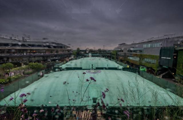 250702 Covers are seen on the outside courts due to rain during day 3 of Wimbledon on July 2, 2025 in London . Photo: Petter Arvidson BILDBYRAN kod PA PA1047 tennis wimbledon day 3 bbeng regn regnskydd överdrag Copyright: PETTERxARVIDSON BB250702PA001