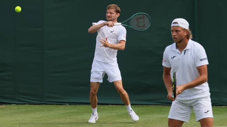Belgian David Goffin and Luxembourgish Gilles Muller pictured in action during a doubles tennis match with Belgian-German pair Goffin - Muller against Colombian-Indian pair Barrientos - Bollipalli, in the first round of the men s doubles at the 2025 Wimbledon grand slam tournament, Wednesday 02 July 2025 at the All England Tennis Club, in South-West London, Britain. BENOITxDOPPAGNE  x128271055x