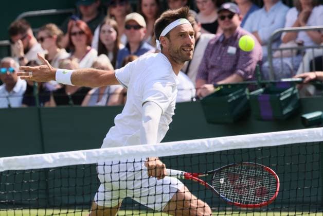 Belgian Sander Gille pictured in action during a doubles tennis match with Belgian-Indian pair Gille - Bopanna against German pair Putz - Krawietz, in the first round of the men s doubles at the 2025 Wimbledon grand slam tournament, Wednesday 02 July 2025 at the All England Tennis Club, in South-West London, Britain. BENOITxDOPPAGNE  x128272625x