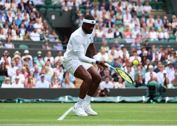2nd July 2025; All England Lawn Tennis and Croquet Club, London, England; Wimbledon Tennis Tournament, Day 3; Frances Tiafoe (FRA) with a forehand shot to Cameron Norrie (GBR)  ActionPlus12807910 JohnxPatrickxFletcher