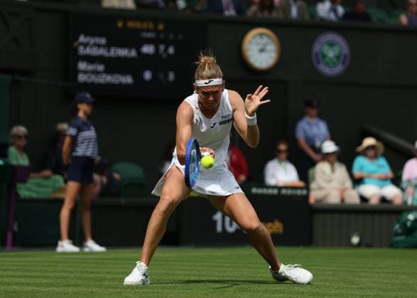 2nd July 2025; All England Lawn Tennis and Croquet Club, London, England; Wimbledon Tennis Tournament, Day 3; Marie Bouzkova (CZE) with a forehand shot to Aryna Sabalenka (BEL)  ActionPlus12807901 JohnxPatrickxFletcher