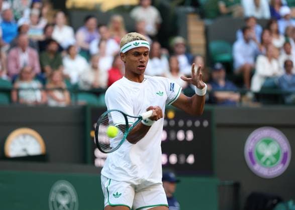 2nd July 2025; All England Lawn Tennis and Croquet Club, London, England; Wimbledon Tennis Tournament, Day 3; Gabriel Diallo (CAN) with a forehand shot to Taylor Fritz (USA)  ActionPlus12808037 JohnxPatrickxFletcher