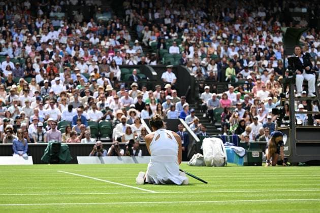 (250703) -- LONDON, July 3, 2025 -- Aryna Sabalenka reacts after losing a point during the women s singles second round match between Aryna Sabalenka of Belarus and Marie Bouzkova of the Czech Republic at the Wimbledon Tennis Championships in London, Britain, July 2, 2025. ) (SP)BRITAIN-LONDON-TENNIS-WIMBLEDON-WOMEN S SINGLES ZhaoxDingzhe 