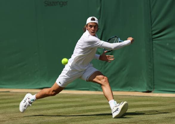 3rd July 2025; All England Lawn Tennis and Croquet Club, London, England; Wimbledon Tennis Tournament, Day 4; Arthur Cazaux (FRA) with a backhand shot to Alex de Minaur (AUS)  ActionPlus12808113 JohnxPatrickxFletcher