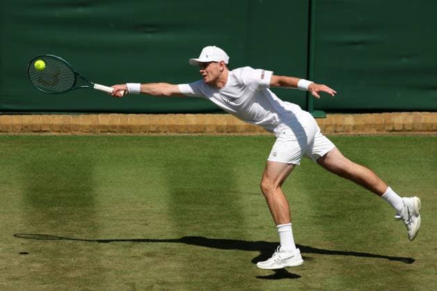 3rd July 2025; All England Lawn Tennis and Croquet Club, London, England; Wimbledon Tennis Tournament, Day 4; Jack Pinnington Jones (GBR) with a forehand shot to Flavio Cobolli (ITA)  ActionPlus12808118 JohnxPatrickxFletcher