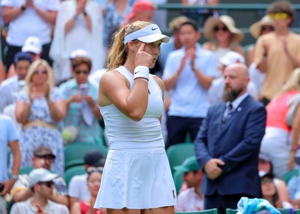 3rd July 2025; All England Lawn Tennis and Croquet Club, London, England; Wimbledon Tennis Tournament, Day 4; Mirra Andreeva (RUS) taps her temple towards her coaches on Court Number One after defeating Lucia Bronzetti (ITA) by straight sets to reach the next round  ActionPlus12808149 JohnxPatrickxFletcher