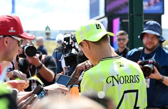 3rd July 2025; Silverstone Circuit, Northamptonshire, England; Formula 1 2025 Qatar Airways British F1 Grand Prix; Arrivals and Inspection Day; Lando Norris of McLaren signs autographs on arrival at Silverstone  ActionPlus12808225 SimonxWest
