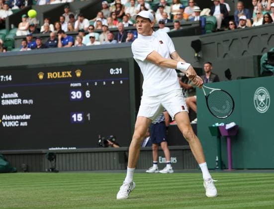 Italian Jannik Sinner plays a backhand in his second round match against Australia s Aleksandar Vukic on day four of the 2025 Wimbledon Championships in London on Thursday, June 03, 2025.  LON2025070368 HUGOxPHILPOTT