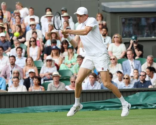 Italian Jannik Sinner plays a backhand in his second round match against Australia s Aleksandar Vukic on day four of the 2025 Wimbledon Championships in London on Thursday, June 03, 2025.  LON2025070369 HUGOxPHILPOTT
