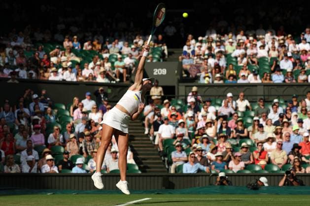 3rd July 2025; All England Lawn Tennis and Croquet Club, London, England; Wimbledon Tennis Tournament, Day 4; Caty McNally (USA) serves to Iga Swiatek (POL)  ActionPlus12808515 JohnxPatrickxFletcher