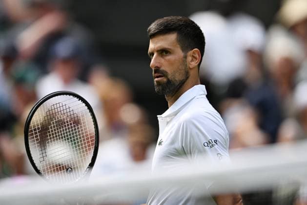 (250704) -- LONDON, July 4, 2025 -- Novak Djokovic reacts during the men s singles second round match between Novak Djokovic of Serbia and Daniel Evans of Britain at the Wimbledon Tennis Championships in London, Britain, July 3, 2025. ) (SP)BRITAIN-LONDON-TENNIS-WIMBLEDON-MEN S SINGLES ZhaoxDingzhe 