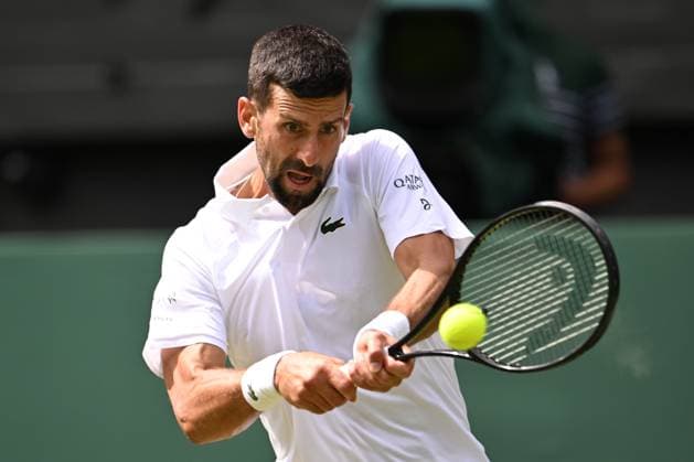 (250704) -- LONDON, July 4, 2025 -- Novak Djokovic hits a return during the men s singles second round match between Novak Djokovic of Serbia and Daniel Evans of Britain at the Wimbledon Tennis Championships in London, Britain, July 3, 2025. ) (SP)BRITAIN-LONDON-TENNIS-WIMBLEDON-MEN S SINGLES ZhaoxDingzhe 