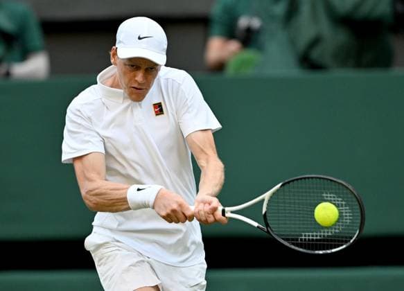 (250704) -- LONDON, July 4, 2025 -- Jannik Sinner hits a return during the men s singles second round match between Jannik Sinner of Italy and Aleksandar Vukic of Australia at the Wimbledon Tennis Championships in London, Britain, July 3, 2025. ) (SP)BRITAIN-LONDON-TENNIS-WIMBLEDON-MEN S SINGLES LixYing 
