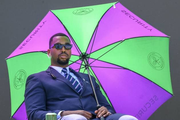 Wimbledon Tennis Championships - Day 5 LONDON, UNITED KINGDOM - JULY 4: A security guards uses an umbrella to protect themselves form then hot weather whilst watching tennis during the fifth day of the 2025 Wimbledon Championships at The All England Lawn Tennis and Croquet Club in Wimbledon on July 4, 2025, in London, United Kingdom. Ray Tang Anadolu London United Kingdom. Editorial use only. Please get in touch for any other usage.  Copyright: x2025xAnadoluxRayxTangx