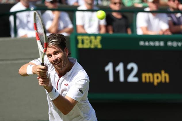 Great Britain s Cameron Norrie plays a backhand in his third round match against Italian Mattia Bellucci on day five of the 2025 Wimbledon Championships in London on Friday, July 04, 2025.  LON2025070464 HUGOxPHILPOTT