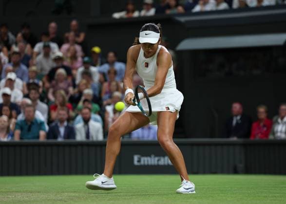 4th July 2025; All England Lawn Tennis and Croquet Club, London, England; Wimbledon Tennis Tournament, Day 5; Emma Raducanu (GBR) with a backhand shot to Aryna Sabalenka (BLR)  ActionPlus12809197 JohnxPatrickxFletcher