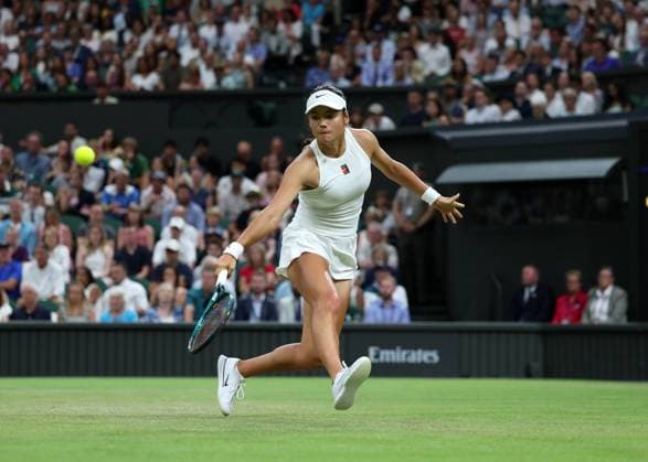 4th July 2025; All England Lawn Tennis and Croquet Club, London, England; Wimbledon Tennis Tournament, Day 5; Emma Raducanu (GBR) with a backhand shot to Aryna Sabalenka (BLR)  ActionPlus12809200 JohnxPatrickxFletcher