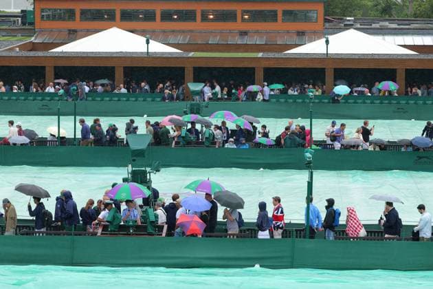 5th July 2025; All England Lawn Tennis and Croquet Club, London, England; Wimbledon Tennis Tournament, Day 6; Heavy rain delays play on all courts as spectators run to find cover  ActionPlus12809281 JohnxPatrickxFletcher