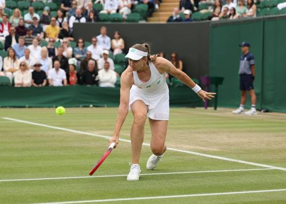 5th July 2025; All England Lawn Tennis and Croquet Club, London, England; Wimbledon Tennis Tournament, Day 6; Elena Rybakina (KAZ) with a backhand shot to Clara Tauson (DEN)  ActionPlus12809295 JohnxPatrickxFletcher