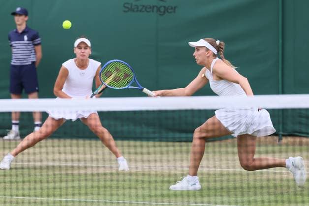 Russian Veronika Kudermetova and Belgian Elise Mertens pictured during a doubles tennis match against Czech-Kazakh pair Bouzkova-Danilina, in the second round of the women s doubles at the 2025 Wimbledon grand slam tournament, Saturday 05 July 2025 at the All England Tennis Club, in South-West London, Britain. BENOITxDOPPAGNE  x128483792x