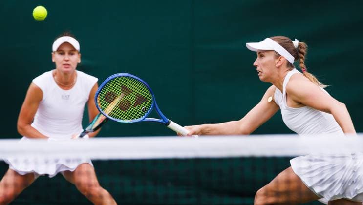 Russian Veronika Kudermetova and Belgian Elise Mertens pictured in action during a doubles tennis match against Czech-Kazakh pair Bouzkova-Danilina, in the second round of the women s doubles at the 2025 Wimbledon grand slam tournament, Saturday 05 July 2025 at the All England Tennis Club, in South-West London, Britain. BENOITxDOPPAGNE  x128487007x