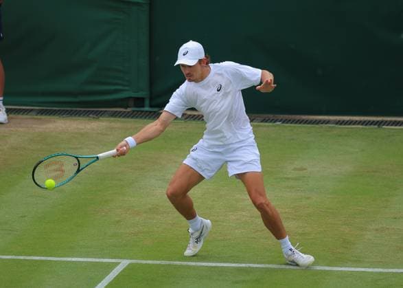 5th July 2025; All England Lawn Tennis and Croquet Club, London, England; Wimbledon Tennis Tournament, Day 6; Alex de Minaur (AUS) with a forehand shot to August Holmgren (DEN)  ActionPlus12809897 JohnxPatrickxFletcher