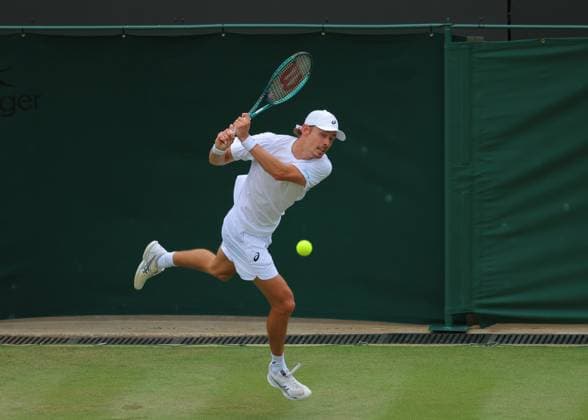 5th July 2025; All England Lawn Tennis and Croquet Club, London, England; Wimbledon Tennis Tournament, Day 6; Alex de Minaur (AUS) with a backhand shot to August Holmgren (DEN)  ActionPlus12809899 JohnxPatrickxFletcher