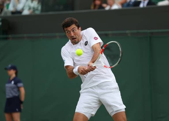 5th July 2025; All England Lawn Tennis and Croquet Club, London, England; Wimbledon Tennis Tournament, Day 6; Sebastian Ofner (AUS) with a backhand shot to Grigor Dimitrov (BUL)  ActionPlus12809911 JohnxPatrickxFletcher